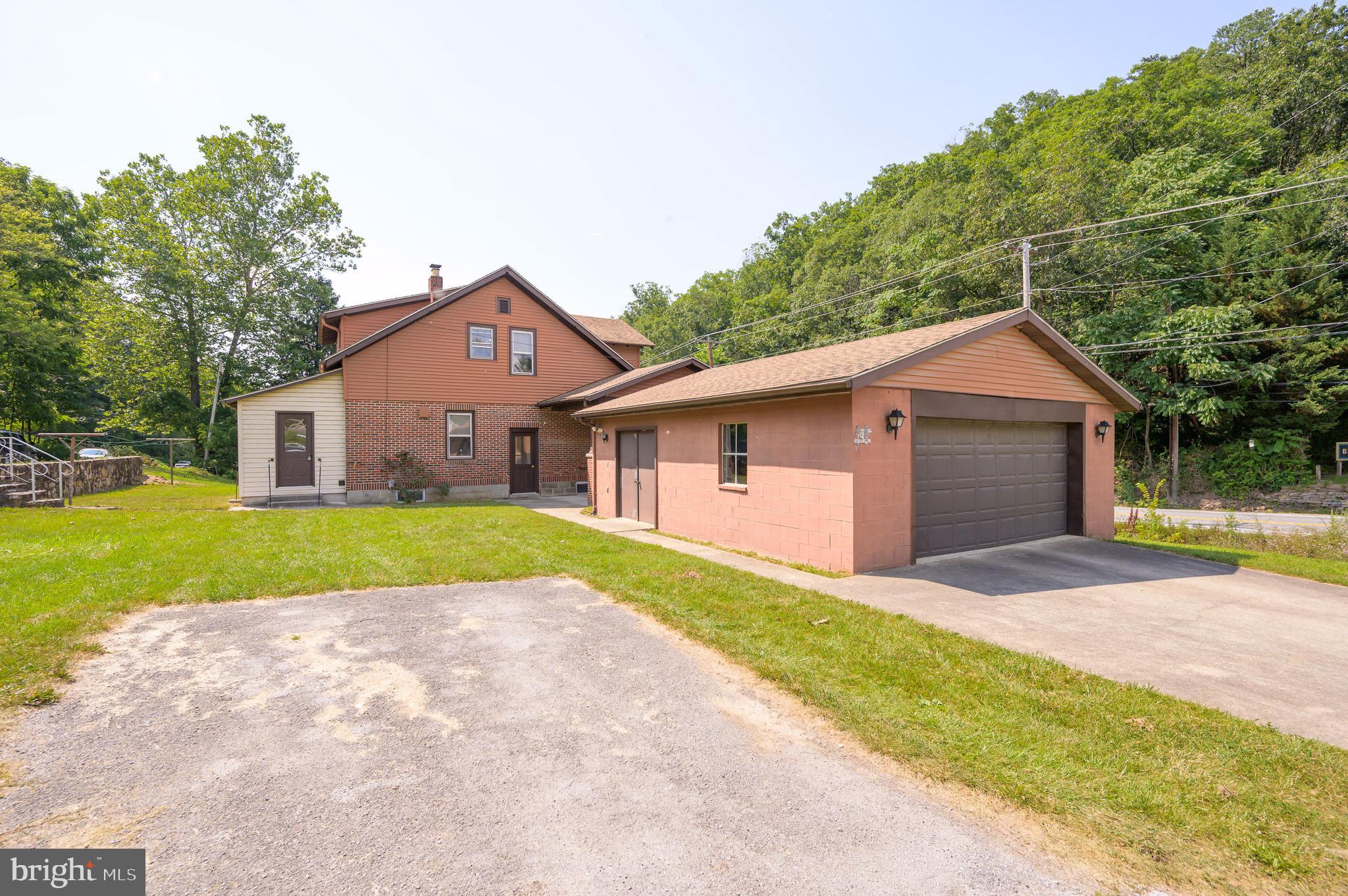 14 Peer Lane Berkeley Springs, WV 25411 - Photo 44 of 52 a front view of house with yard and green space