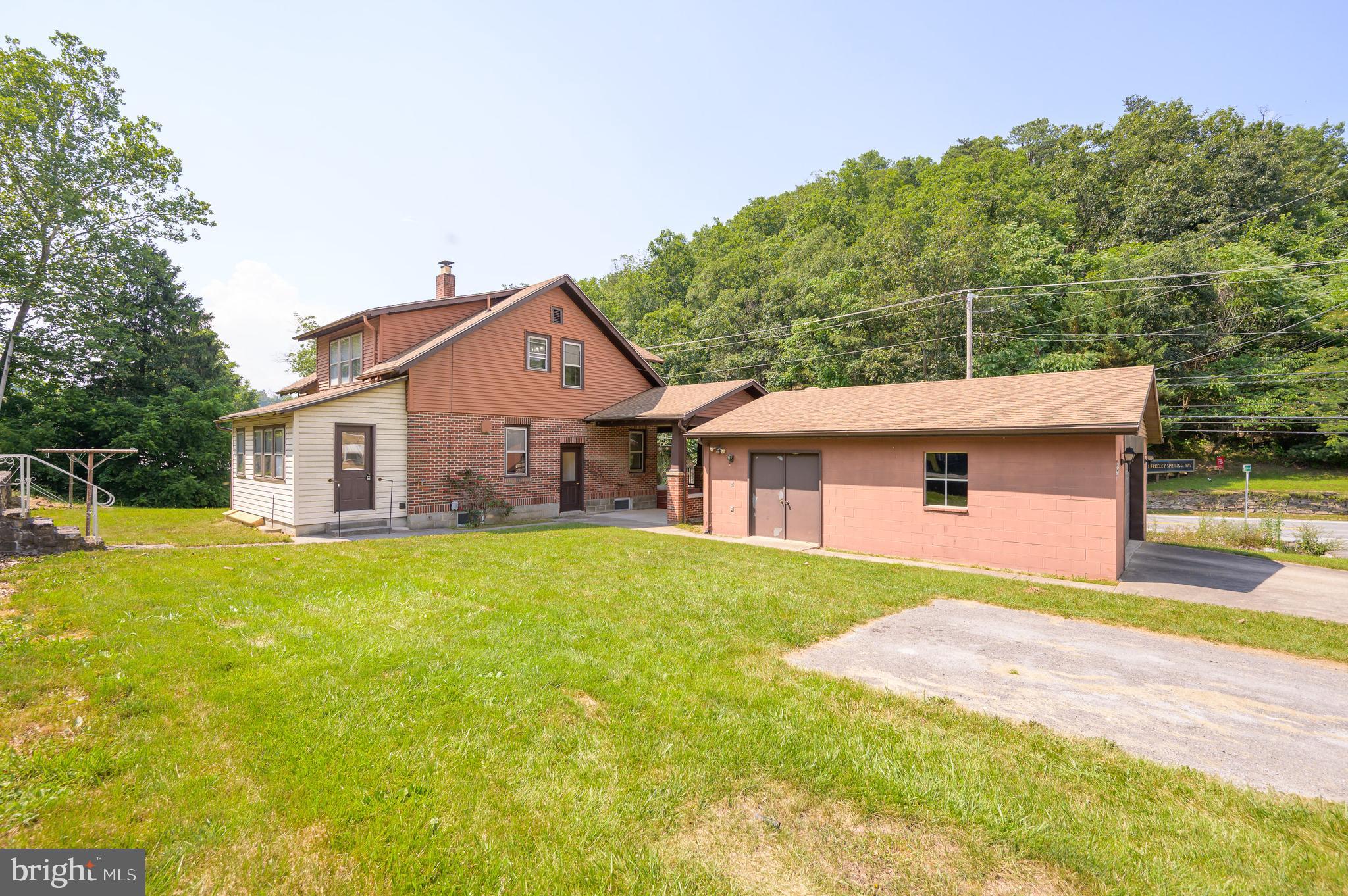 14 Peer Lane Berkeley Springs, WV 25411 - Photo 45 of 52 a front view of a house with a yard and garage