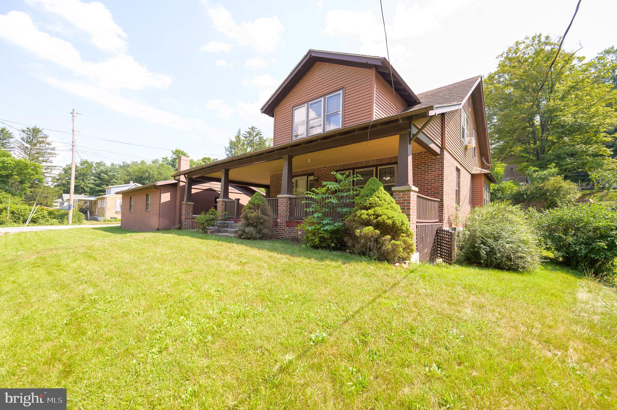 14 Peer Lane Berkeley Springs, WV 25411 - Photo 52 of 52 a front view of a house with a yard