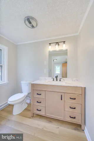a kitchen with a stove cabinets and a refrigerator