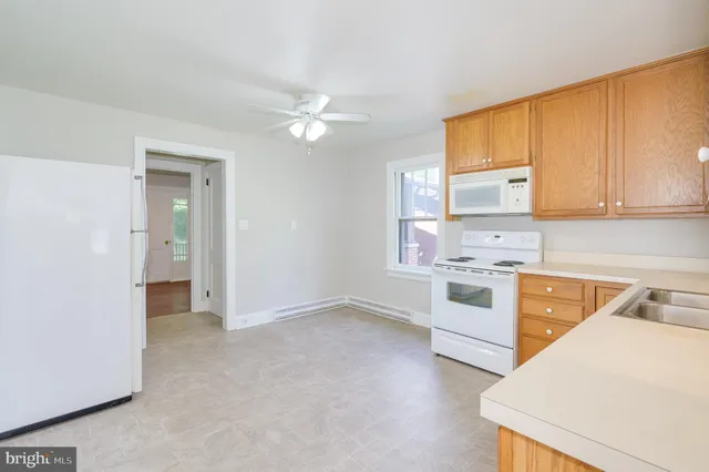 a large kitchen with a window