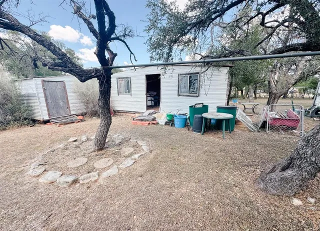 a view of road with large trees