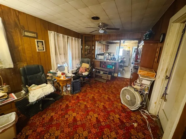a view of a livingroom with furniture and a window