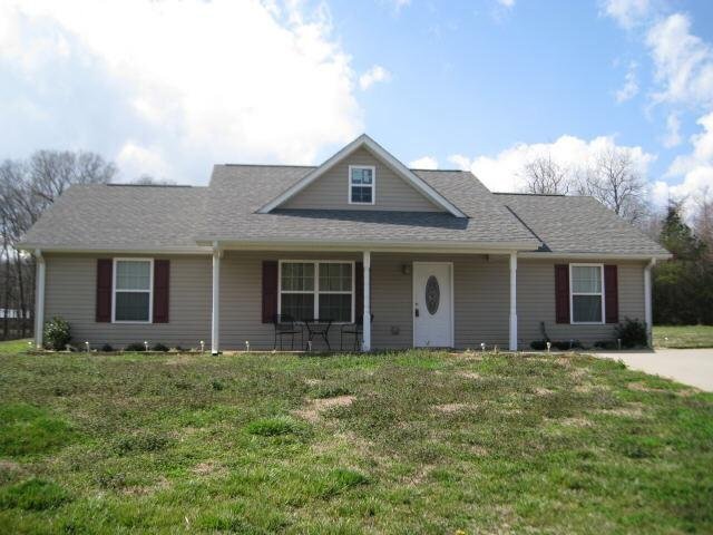 181 Cain Bridge Meadows Road Demorest, GA 30535 - Photo 1 of 1 a front view of a house with yard and glass windows