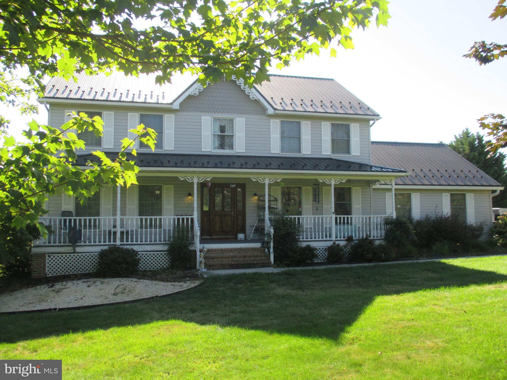 4 Shifflett Place Smithsburg, MD 21783 - Photo 1 of 57 a front view of a house with garden