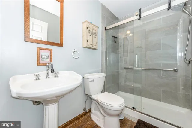 a livingroom with furniture wooden floor and a window