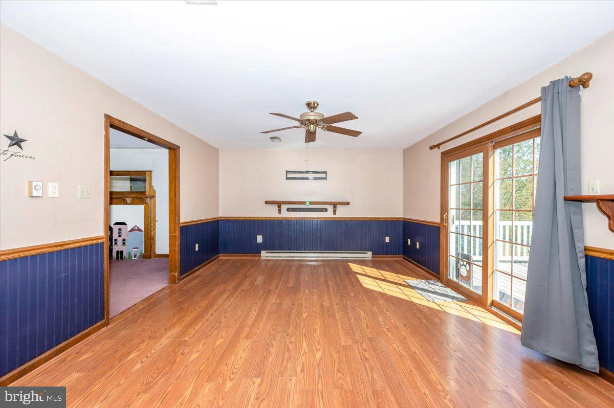 4 Shifflett Place Smithsburg, MD 21783 - Photo 16 of 57 a living room with stainless steel appliances granite countertop furniture wooden floor and a large window