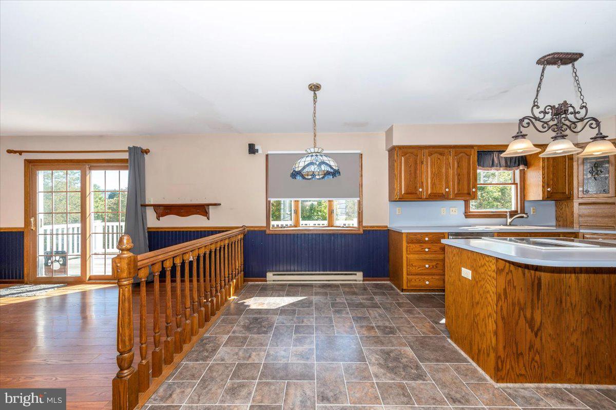 4 Shifflett Place Smithsburg, MD 21783 - Photo 18 of 57 a very nice looking kitchen with granite countertop a stove a sink a window and a dining table