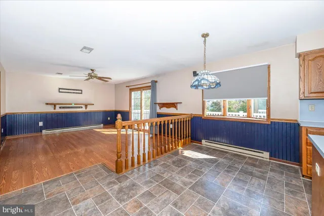 a kitchen with a stove a sink and a refrigerator