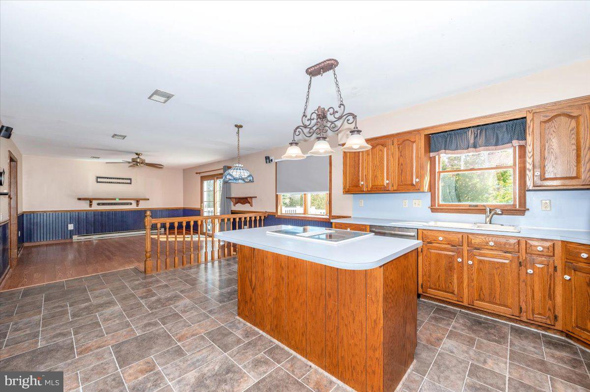 4 Shifflett Place Smithsburg, MD 21783 - Photo 21 of 57 a large kitchen with kitchen island a sink table and chairs