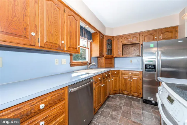 a view of a livingroom with a window wooden floor and chandelier