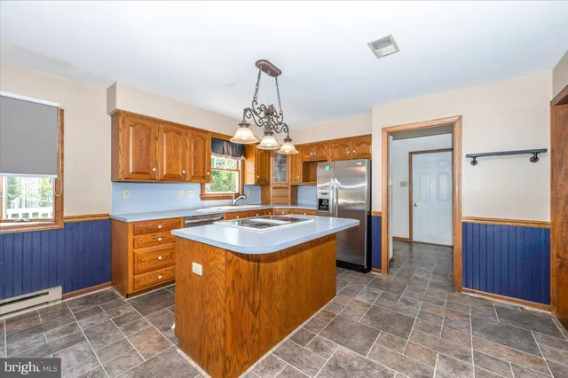 a view of a room with window chandelier and wooden floor