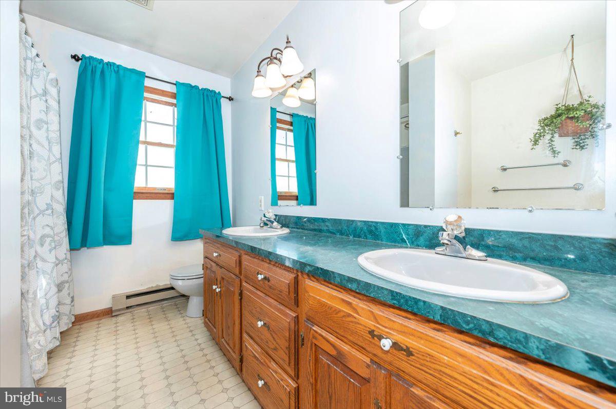 4 Shifflett Place Smithsburg, MD 21783 - Photo 32 of 57 a bathroom with a granite countertop sink and a mirror