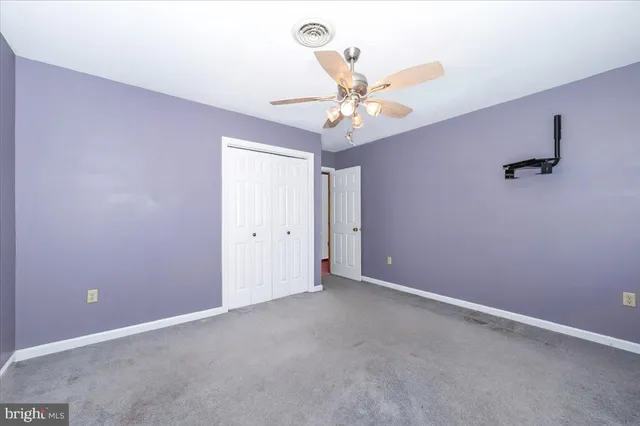 a view of a deck with chairs and wooden floor