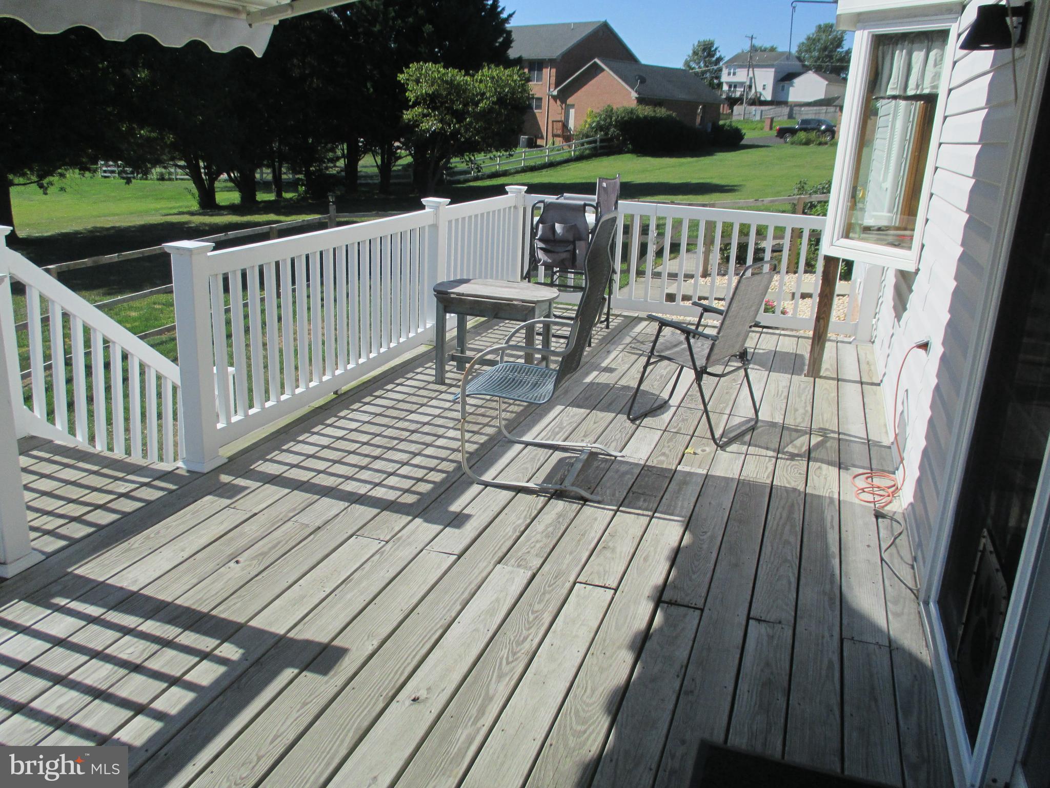 4 Shifflett Place Smithsburg, MD 21783 - Photo 43 of 57 a view of a wooden deck with furniture