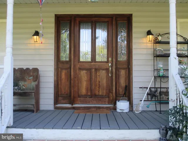 a view of an entryway with wooden floor