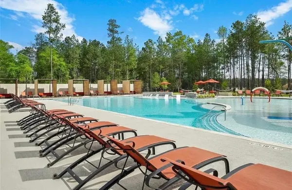 a view of a swimming pool with a patio