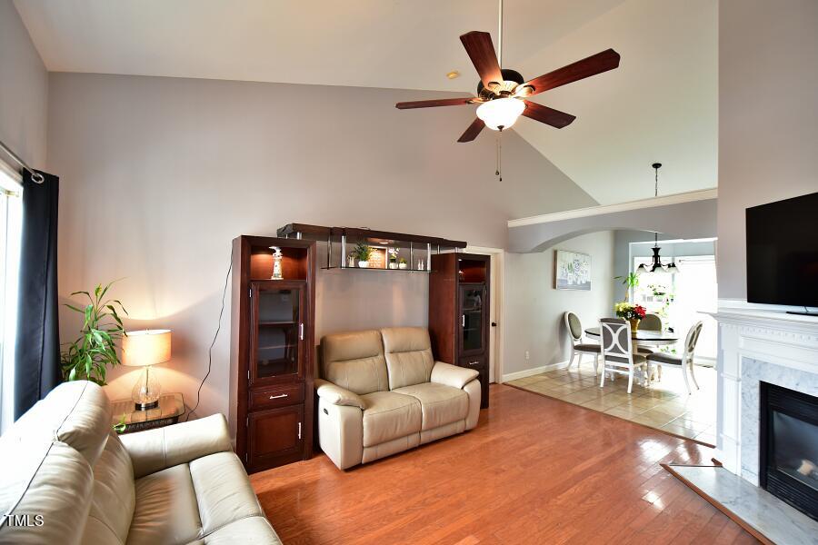 7120 Spanglers Spring Way Raleigh, NC 27610 - Photo 13 of 18 a living room with furniture and a fireplace