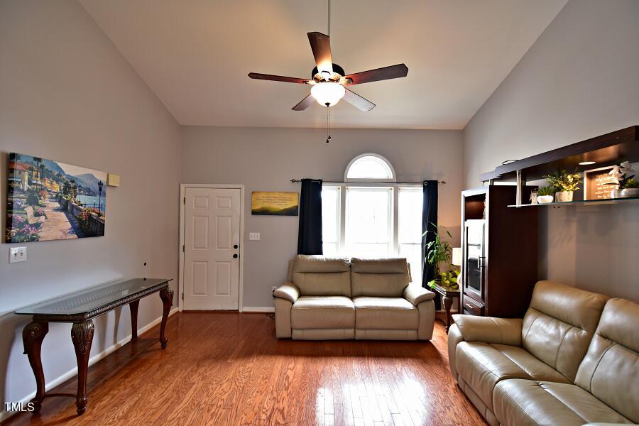 7120 Spanglers Spring Way Raleigh, NC 27610 - Photo 14 of 18 a living room with furniture and a large window