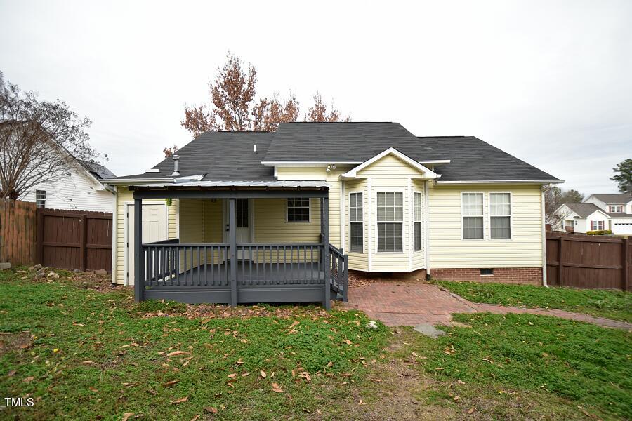 7120 Spanglers Spring Way Raleigh, NC 27610 - Photo 4 of 18 a front view of a house with a garden