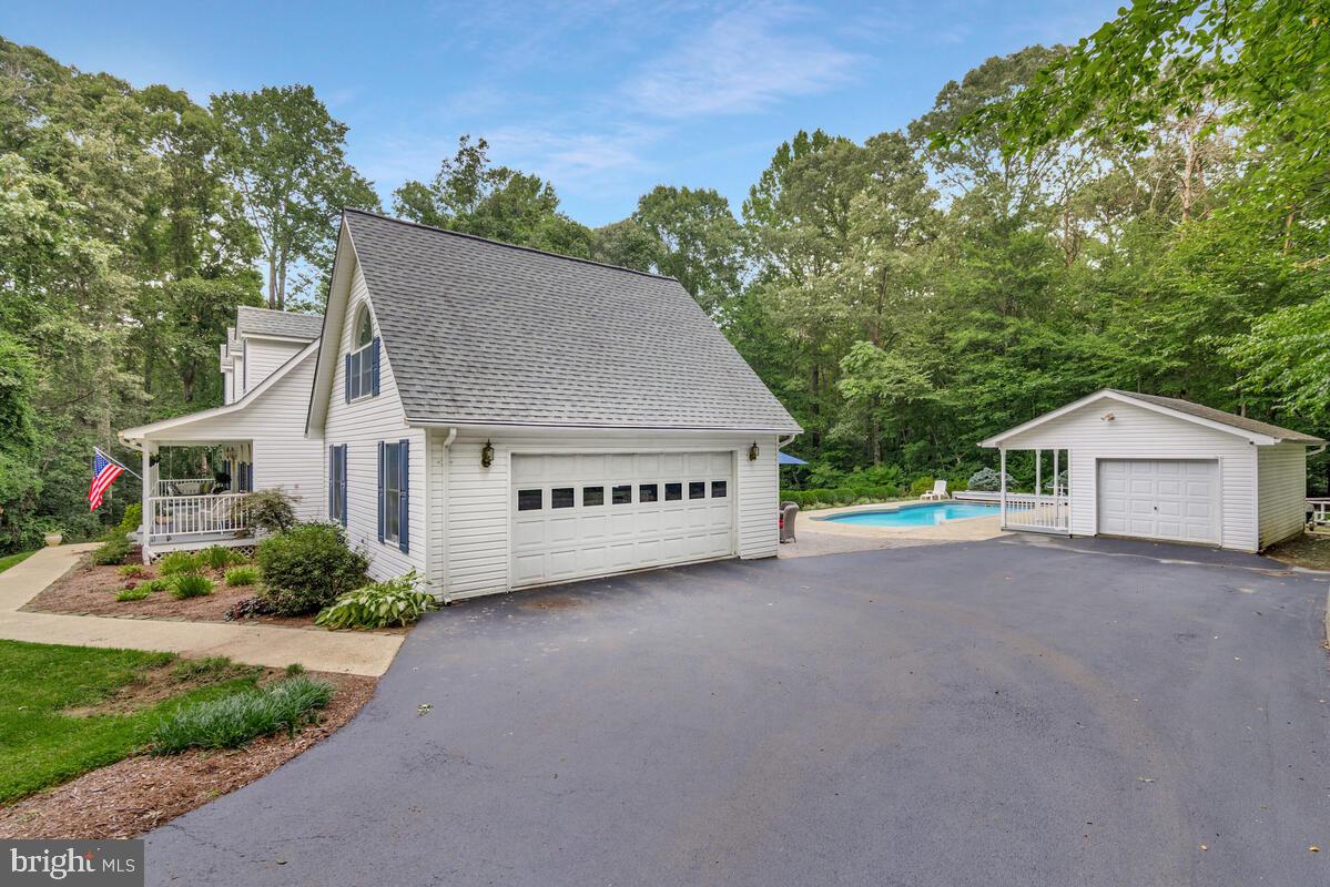 3897 Hunting Creek Road Huntingtown, MD 20639 - Photo 56 of 75 a view of a house with a yard and potted plants