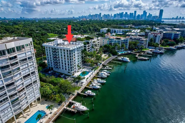 a kitchen with a refrigerator and a sink