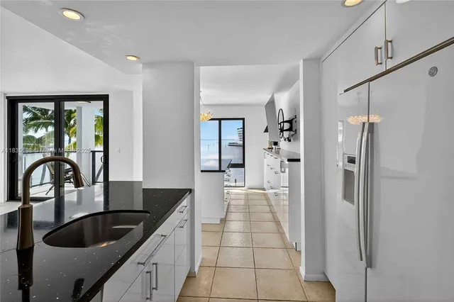 a kitchen with a sink and a microwave