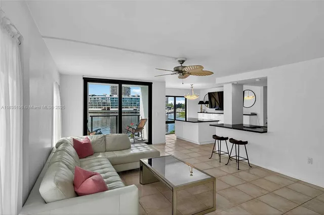 a large kitchen with a large counter top stainless steel appliances and cabinets