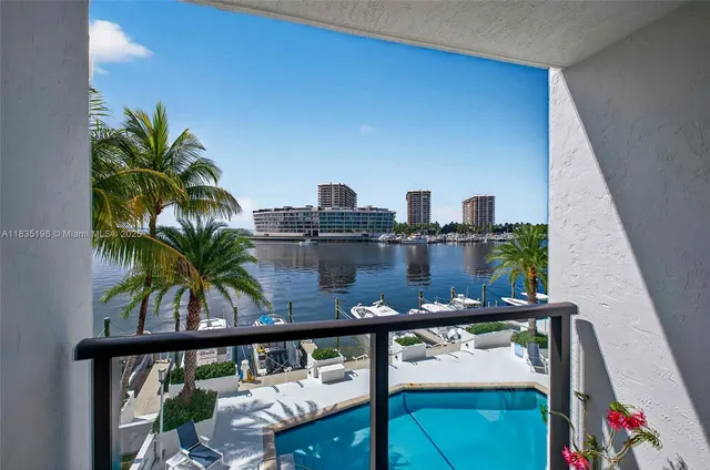 a living room with furniture and large windows