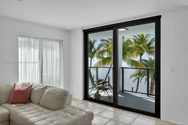 a bedroom with a bed and glass window
