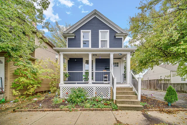 front view of a house with a small yard