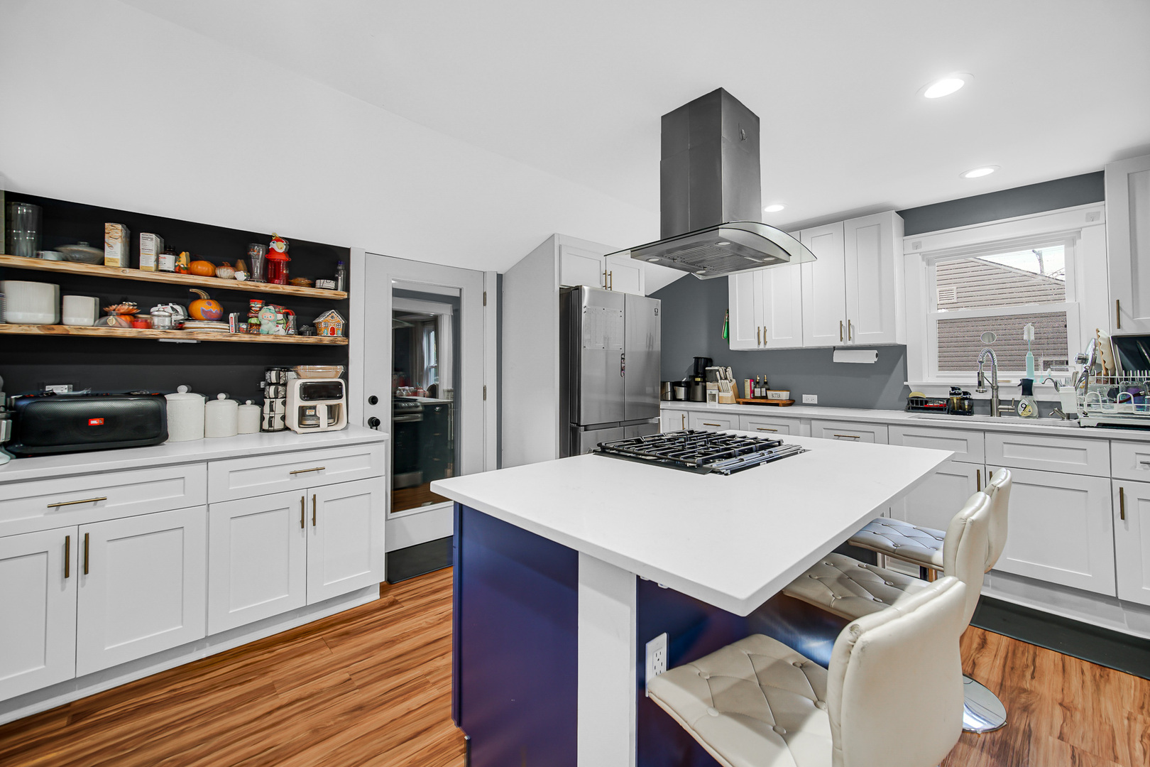 1521 Catalpa Street Waukegan, IL 60085 - Photo 11 of 22 a kitchen with stainless steel appliances a stove a sink dishwasher and a refrigerator