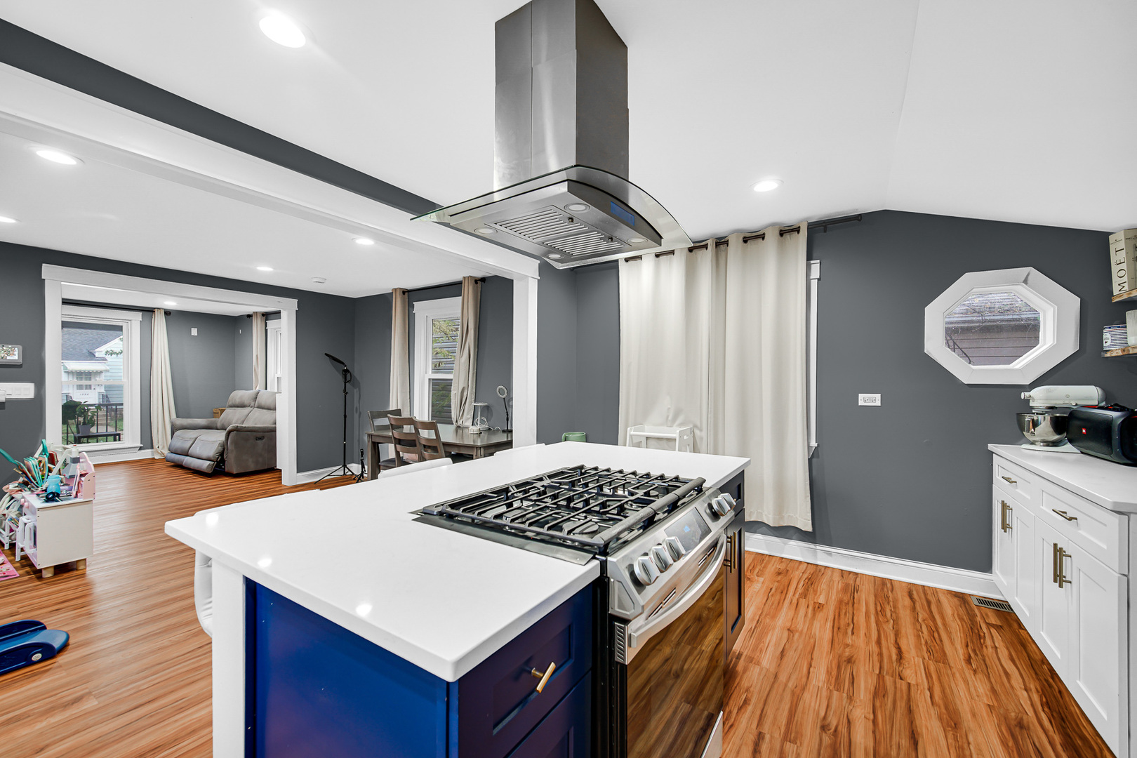 1521 Catalpa Street Waukegan, IL 60085 - Photo 12 of 22 a kitchen with a table chairs and wooden floor