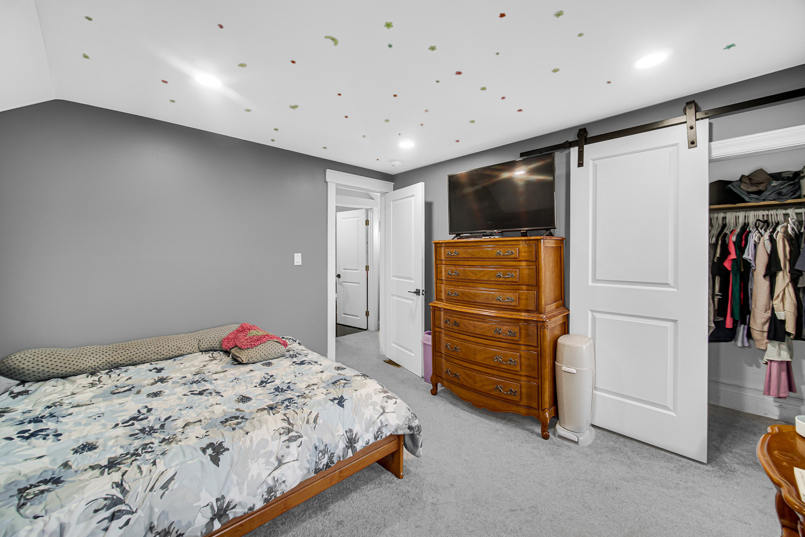 1521 Catalpa Street Waukegan, IL 60085 - Photo 17 of 22 a bedroom with a bed and a walk in closet