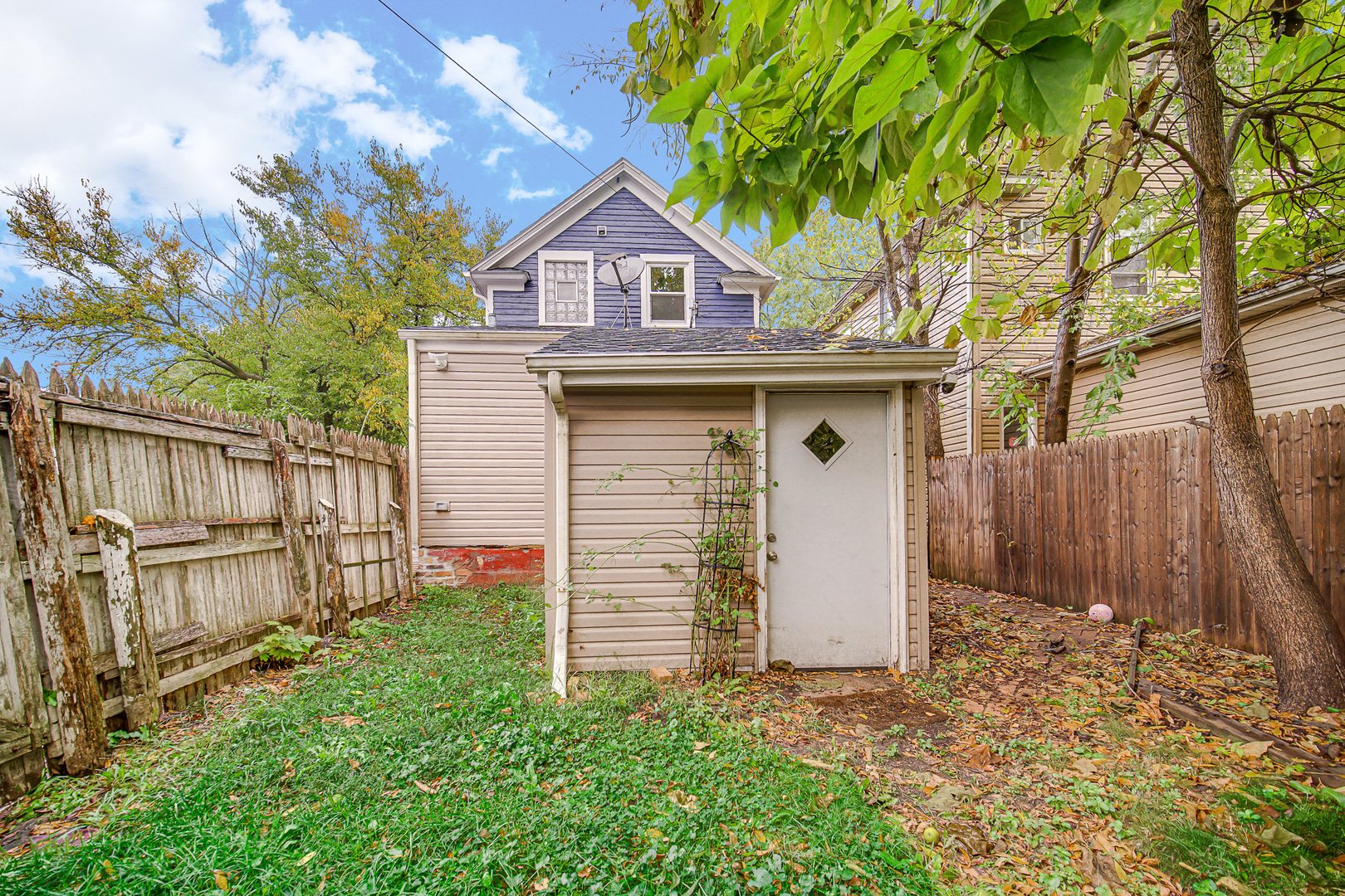 1521 Catalpa Street Waukegan, IL 60085 - Photo 22 of 22 a view of a house with wooden fence