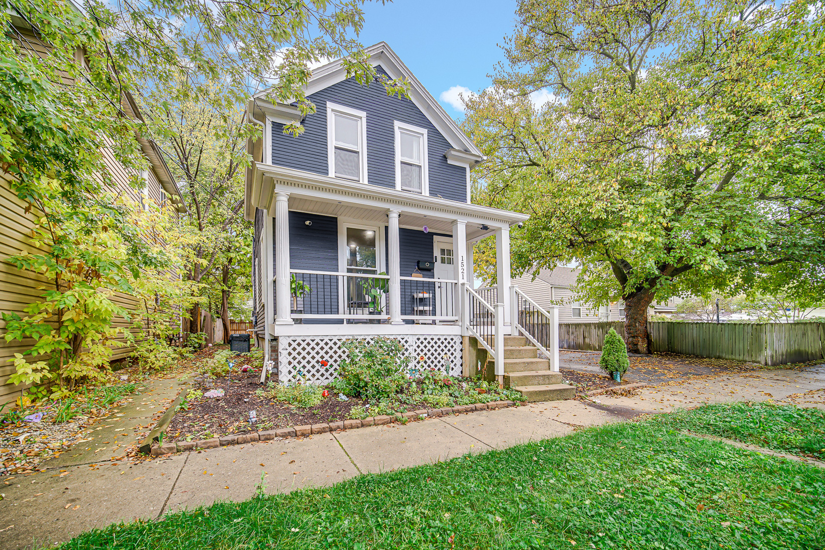 1521 Catalpa Street Waukegan, IL 60085 - Photo 3 of 22 front view of a house with a yard