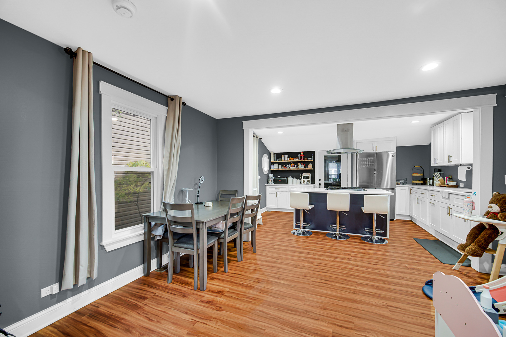 1521 Catalpa Street Waukegan, IL 60085 - Photo 7 of 22 a view of a dining room with furniture and wooden floor
