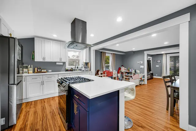 a kitchen with a sink appliances and cabinets