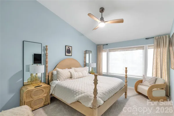 a bedroom with bed and window