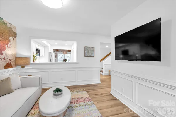 a living room with a flat screen tv and a couch