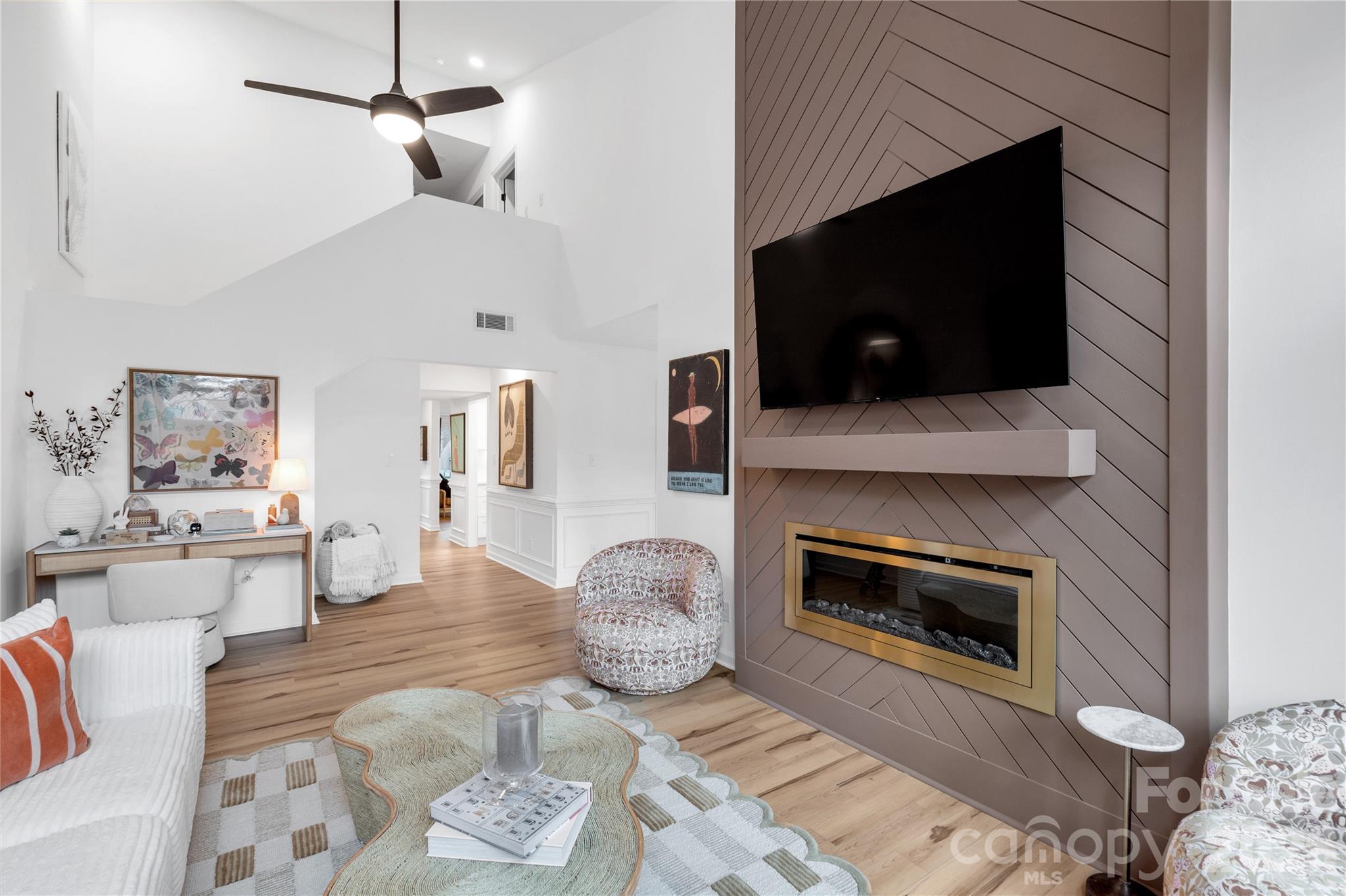 143 Greenridge Road Clover, SC 29710 - Photo 7 of 43 a living room with furniture a flat screen tv and a fireplace
