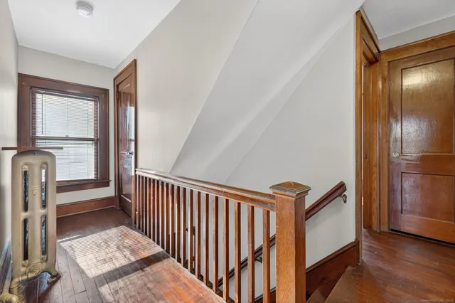 a view of a hallway with staircase