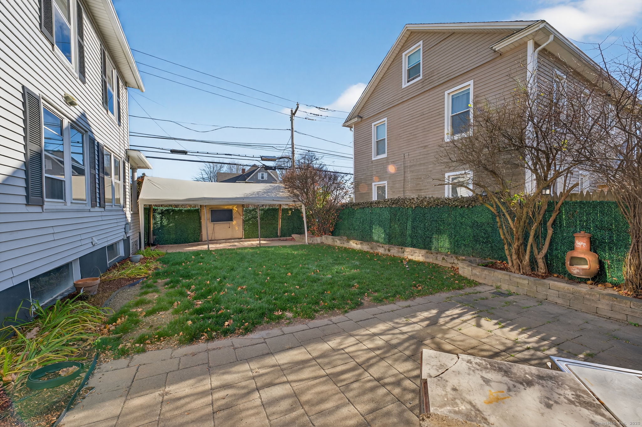 12 North Main Street Windsor Locks, CT 06096 - Photo 22 of 31 a front view of a house with a yard and a garage