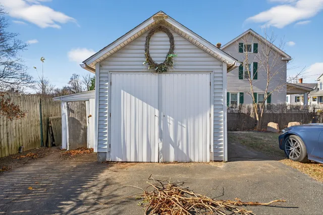 a front view of a house with parking area