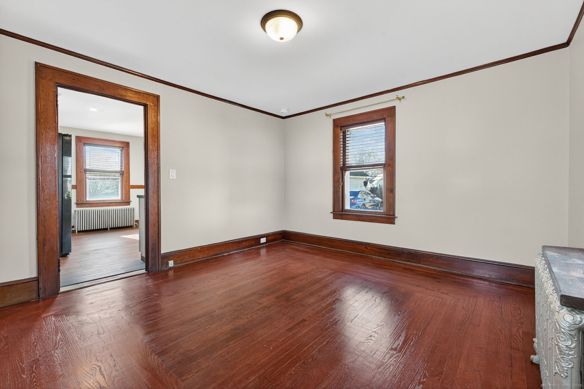 12 North Main Street Windsor Locks, CT 06096 - Photo 8 of 31 an empty room with wooden floor and windows