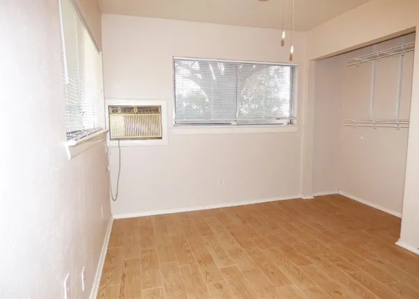 a view of an empty room with glass door