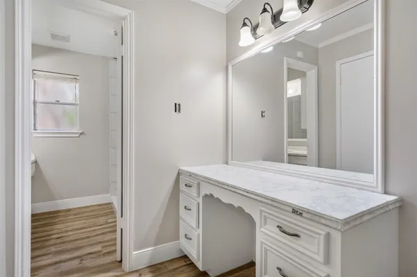 a bathroom with a sink double vanity and a mirror
