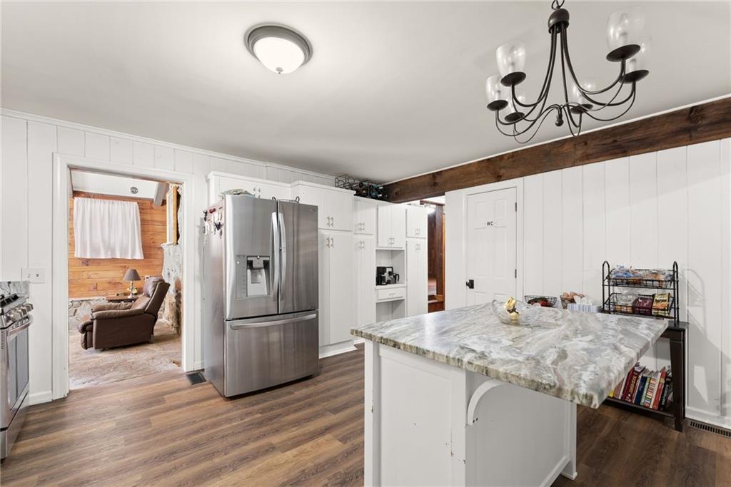 290 Chastain Road Sautee Nacoochee, GA 30571 - Photo 16 of 69 a kitchen with stainless steel appliances granite countertop a refrigerator and a stove top oven