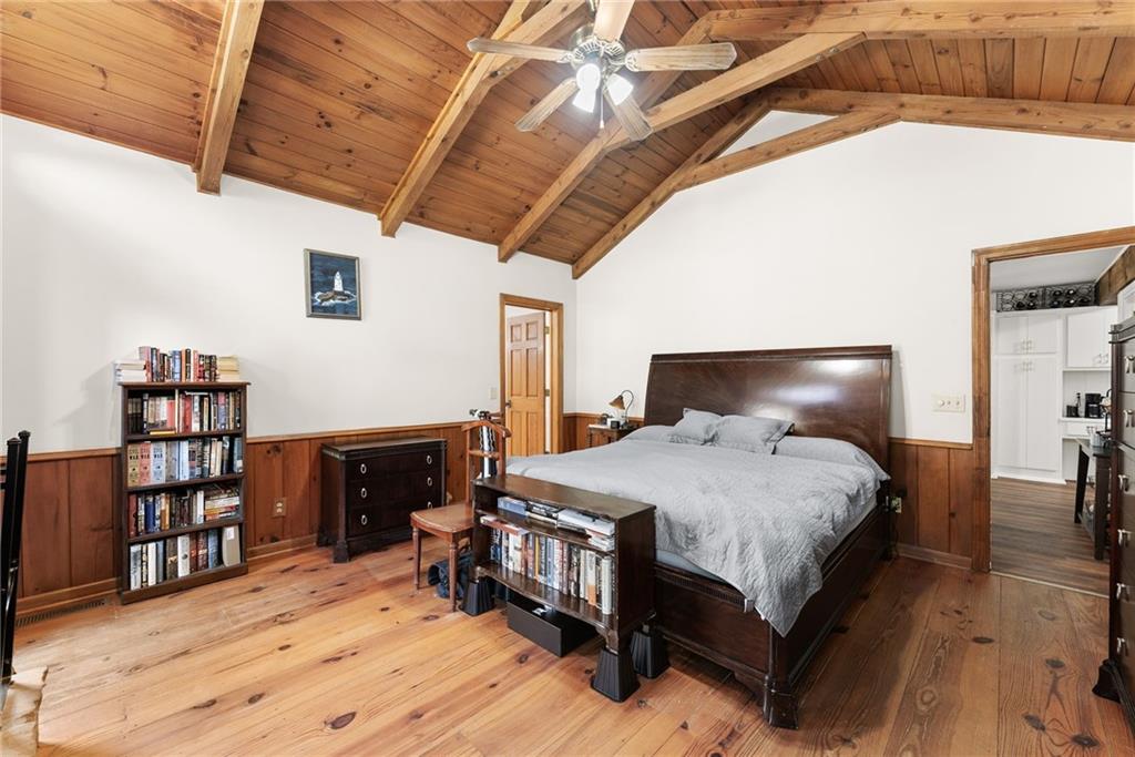 290 Chastain Road Sautee Nacoochee, GA 30571 - Photo 19 of 69 a bedroom with a bed and a book shelf