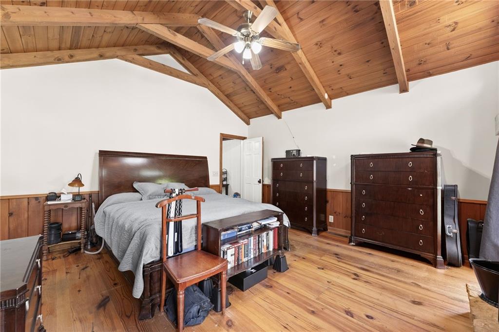 290 Chastain Road Sautee Nacoochee, GA 30571 - Photo 20 of 69 a bedroom with a bed and wooden floor